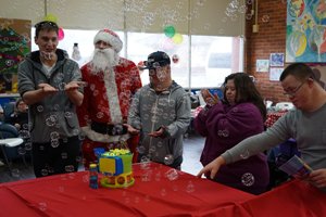 Able clients at the Young Adult Program day centre at their Christmas in July event.