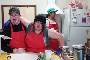 Two Able Young Adult Program clients undertaking a cooking program.