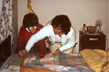 Older Photo Client and Carer making bed