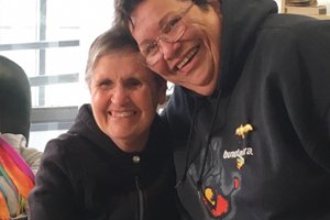 Able client Deb smiling with Aboriginal Elder Judith Jackson at Able's NAIDOC week celebration
