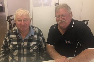 Able client Colin sitting with Able volunteer driver Leon.