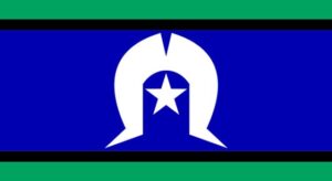 Torres Strait Islander (TSI) flag, representing the Torres Strait Islander people's connection to land, sea, and sky. It features green (land), blue (sea), black (people), and a white dhari (headdress) with a five-pointed star representing island groups.