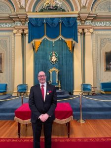 Peter Reilly at Government House to receiving his Order of Australia medal