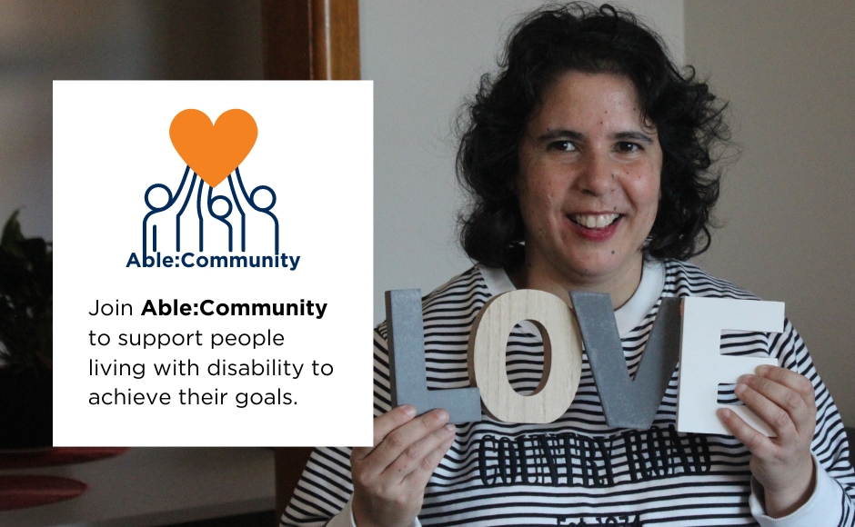 An image with a female holding up a sign that says LOVE. On the left hand side it says Join Able:Community to support people living with disability to acheive their goals.