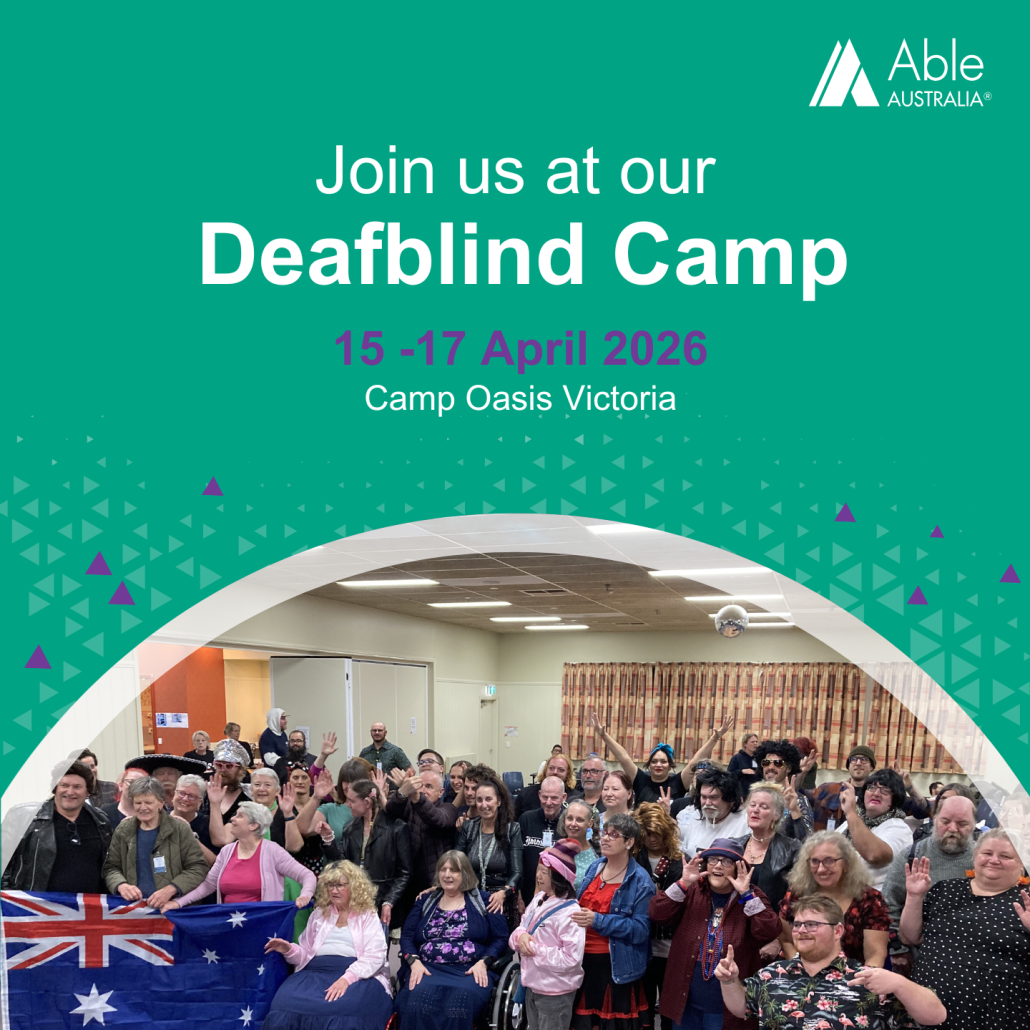 Promotional graphic for Able Australia’s Deafblind Camp, taking place 15–17 April 2026 at Camp Oasis, Victoria. The top half of the image has a green background with white and purple text, and the bottom half shows a large group of smiling people, including people with disabilities, support workers, and community members, posing together indoors. An Australian flag is visible in the foreground.
